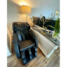 Load image into Gallery viewer, Golden Massage full body massage chair with zero gravity and Bluetooth, grey, positioned beside a desk and lamp.